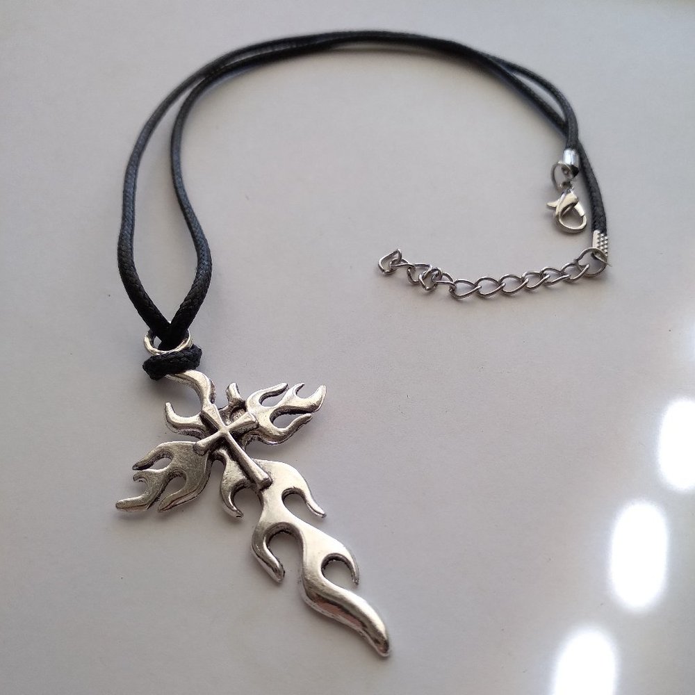 The Gothic Flaming silver tone cross with black rope chain